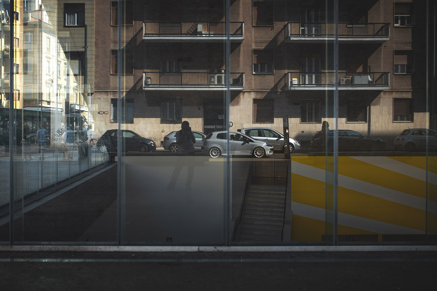 A Punto Evo Abarth Esseesse reflection outside Bocconi University in Milano