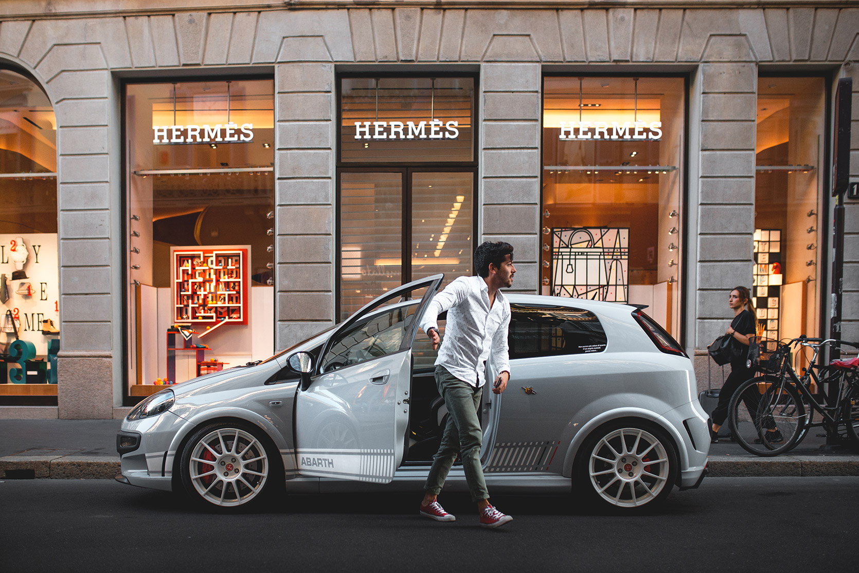 Owner get out from Punto Evo Abarth Esseesse in front of the Hermes boutique in Via Montenapoleone in Milano