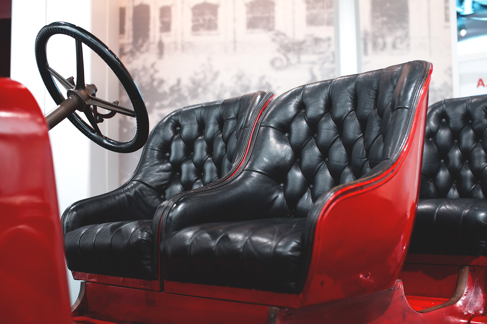 An Alfa Romeo 15HP Corsa seats interiors at Alfa Romeo Museum