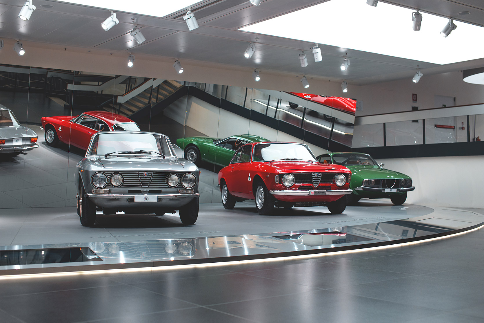 A Giulia Junior, a Giulia GTA and a Giulia Zagato in line at Alfa Romeo Museum