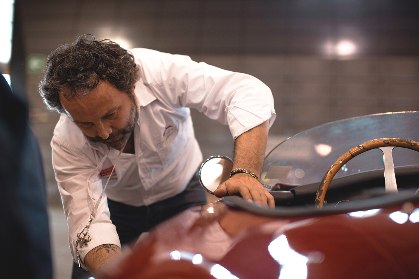 The owner of the Classic Car Charter putting the number on the side of the Ermini 1100 Sport