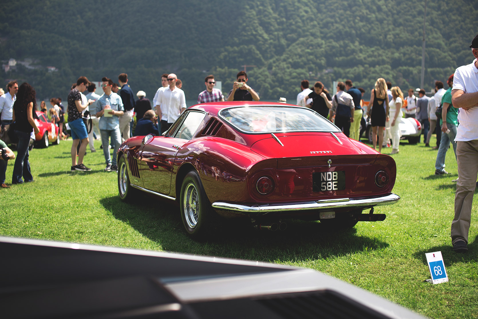 A Ferrari 275 GTB4 parked on grass at Concorso d'Eleganza Villa d'Este