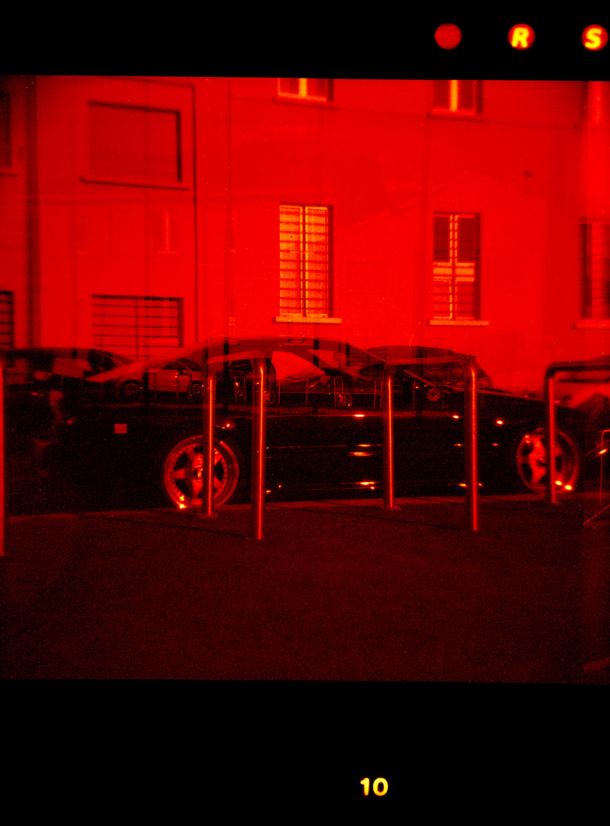 Double exposure of a Mazda Rx-7 FC at Fondazione Prada in Milano
