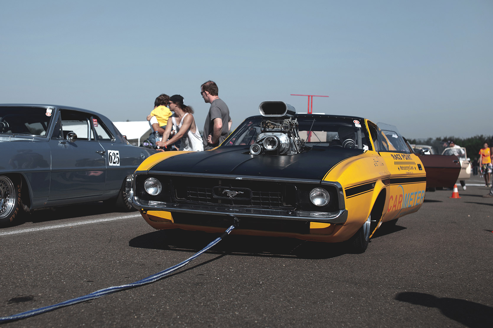 A Ford mustang Dragster is towed to the starting line at Rivanazzano Hills Race