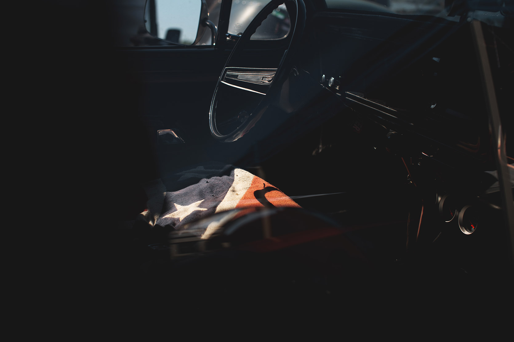 An American flag on a seat of a pick-up truck at Rivanazzano Hills Race