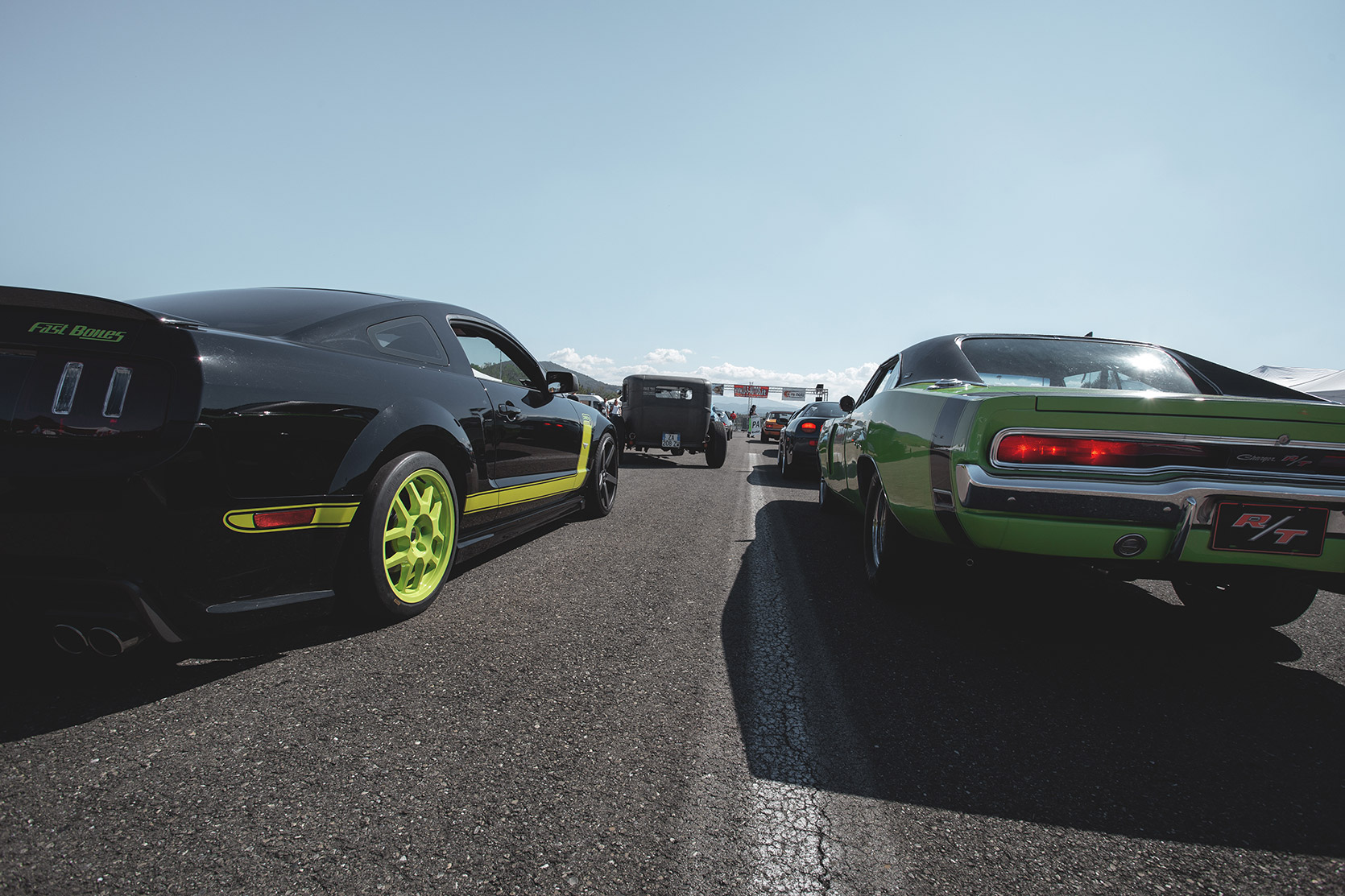 A Mustang GT and a Dodge Charger R/T going to raca at Rivanazzano Hill Race