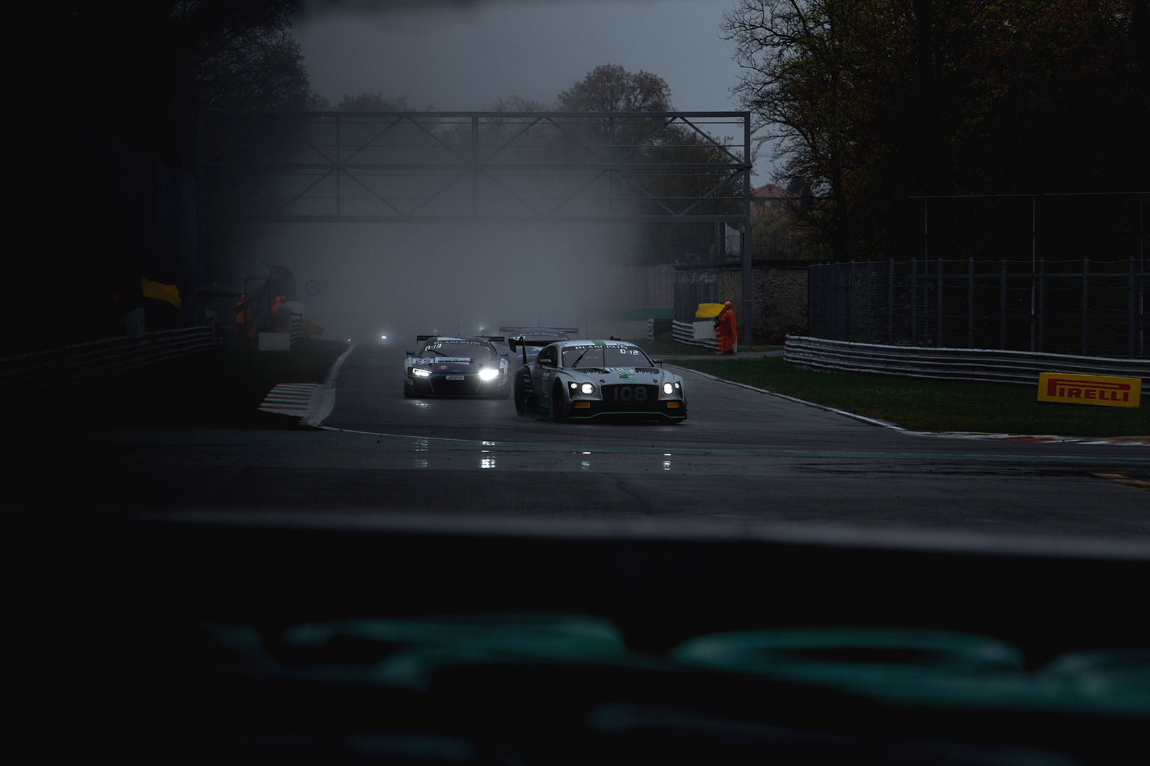 An Audi R8 behind a Bentley Continental Gt approching Seconda Variante Curve in Autodromo Nazionale Monza at Blancpain Gt Series