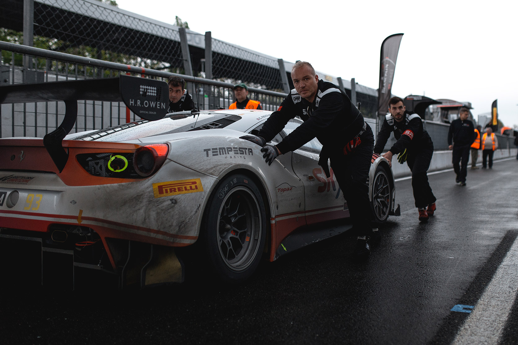 Mechanics pull a Ferrari 488 pista in pitlane of Autodromo Nazionale Monza at Blancpain