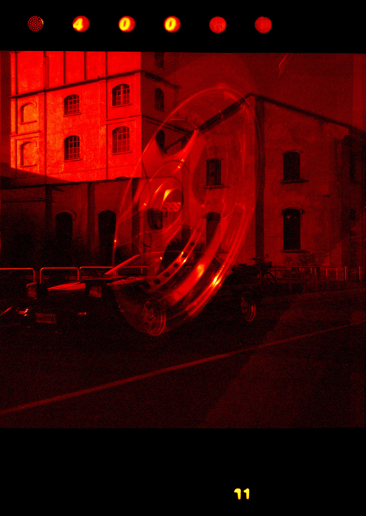 Double exposure film of a Mazda Rx-7 and a BBS wheel in Milano