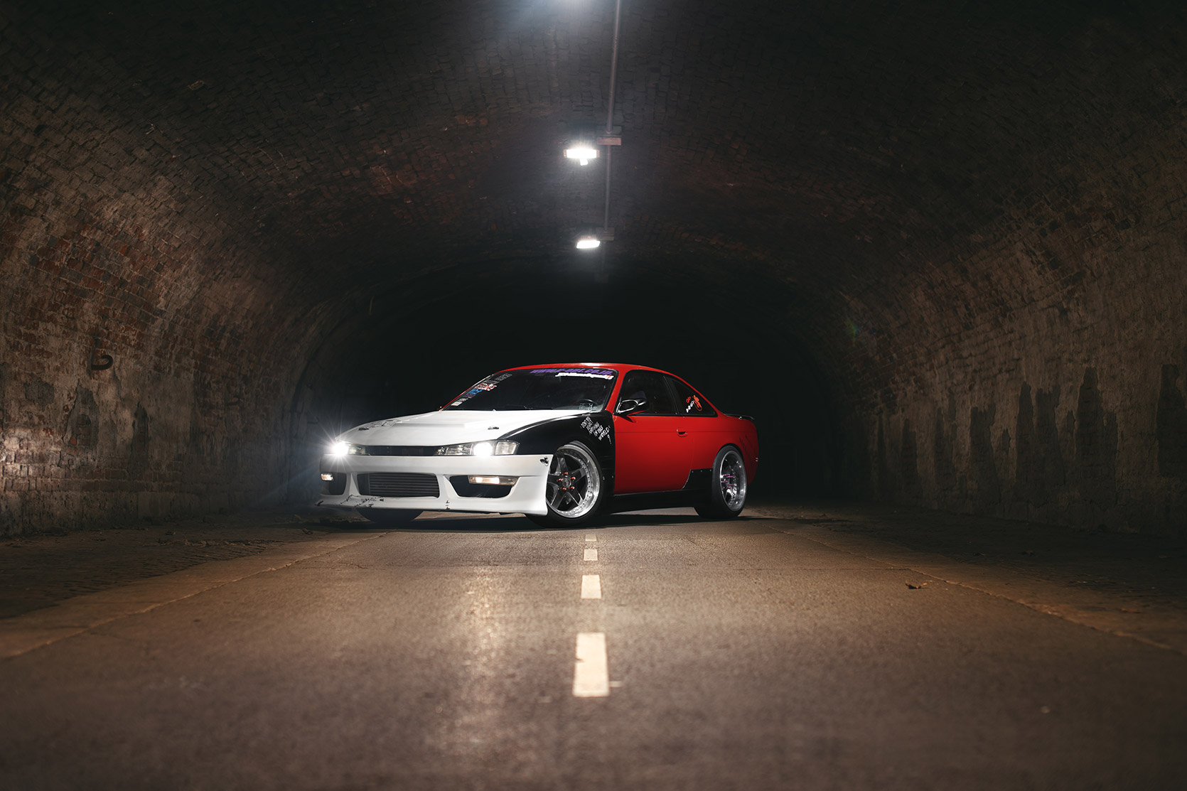 A Nissan Silvia S14 Hardcore lightpainting in a tunnel in Milano