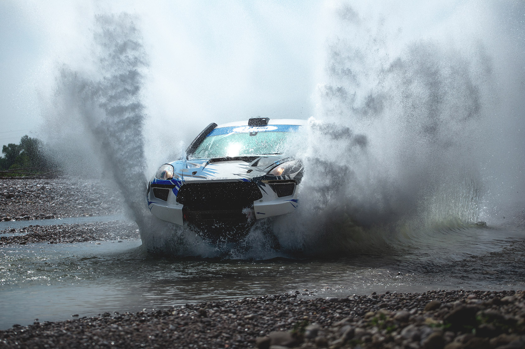 LP Racing on their Porsche Macan jump into water at Italian Baja at Italian Baja