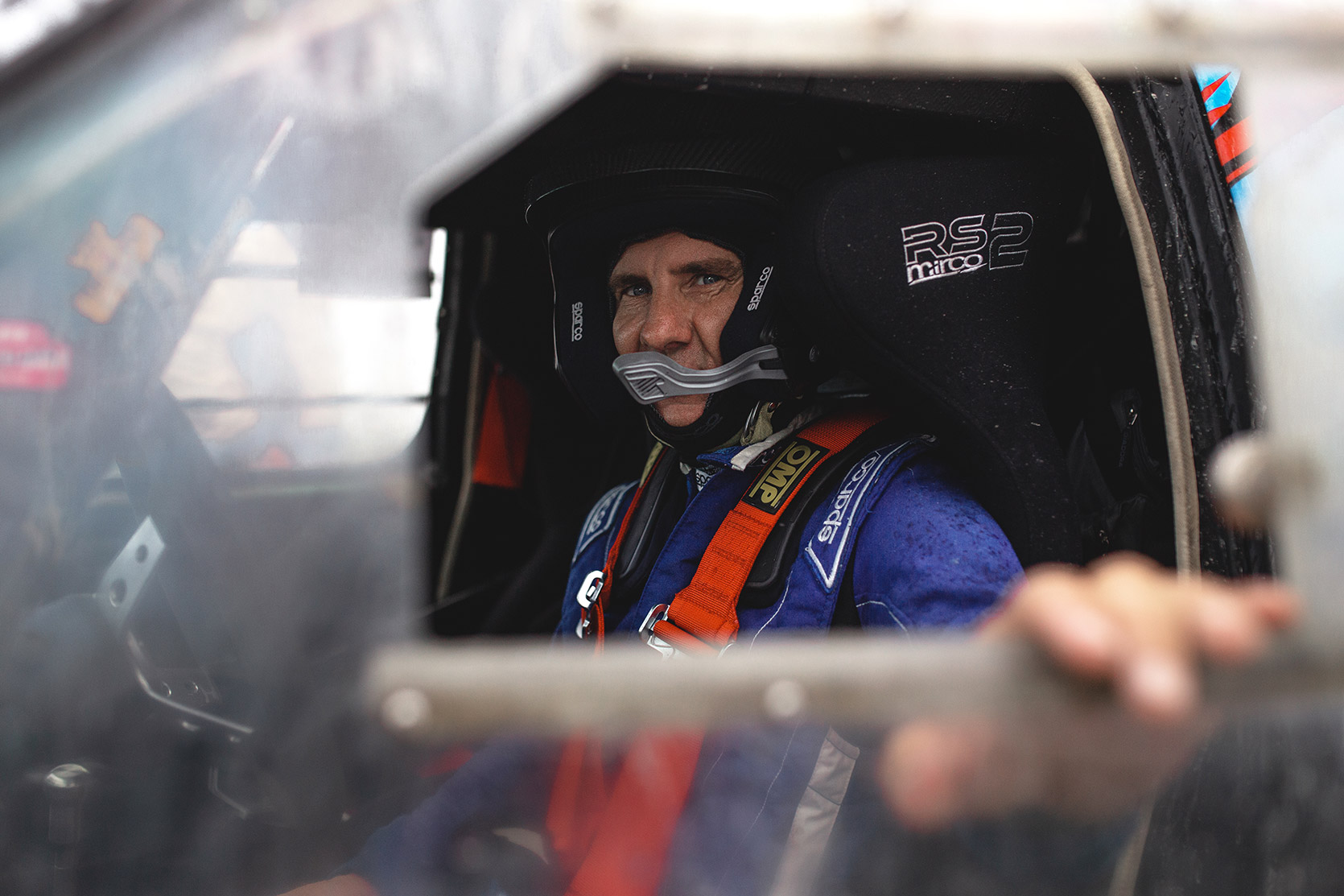 A Racing Driver waiting in his car waiting for the race at Italian Baja