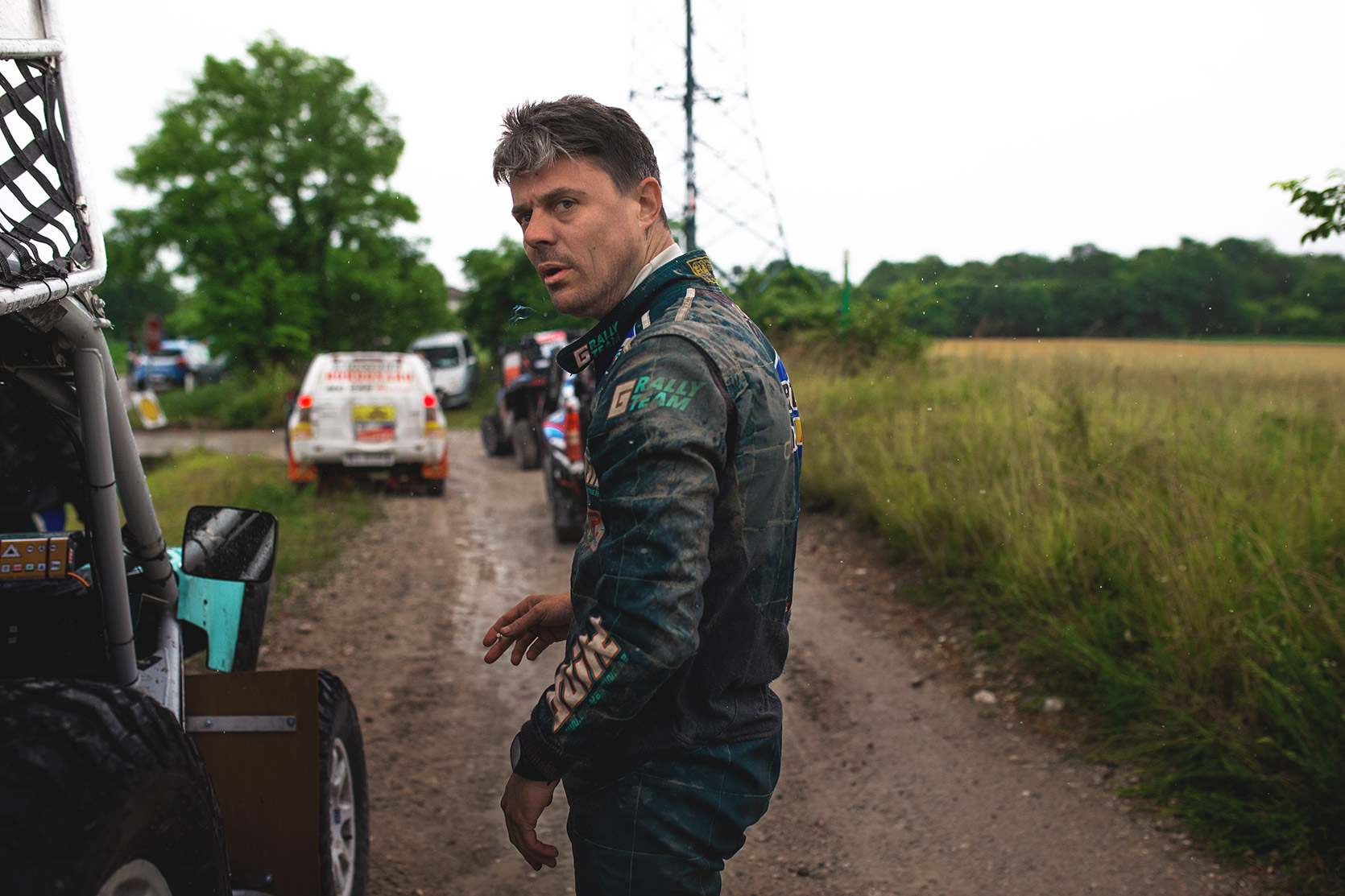 A Racing driver smoking a cigarette while is waiting for the race at Italian Baja