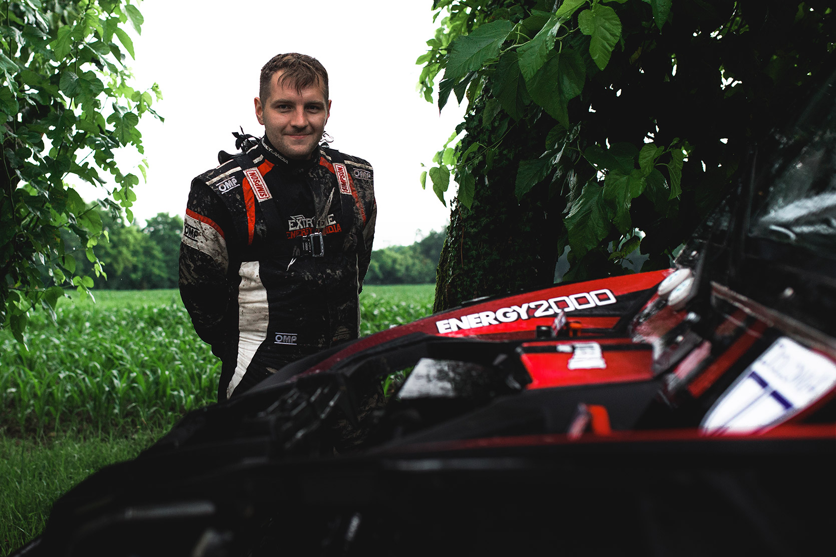 A Racing Driver portrait near his car at Italian Baja