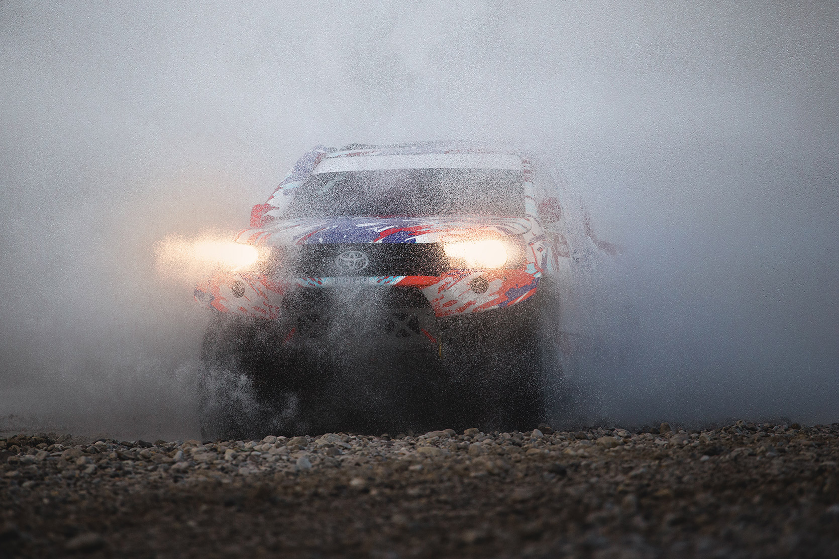 The Overdrive Toyota Hilux passing throught water at Italian Baja