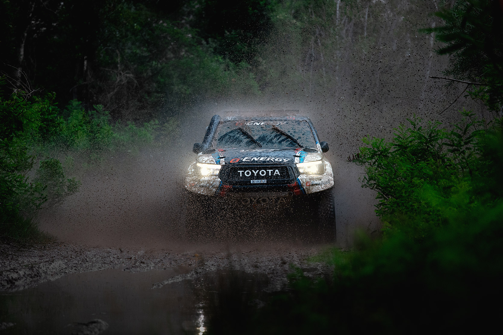 A Toyota Hilux in the mud at Italian Baja