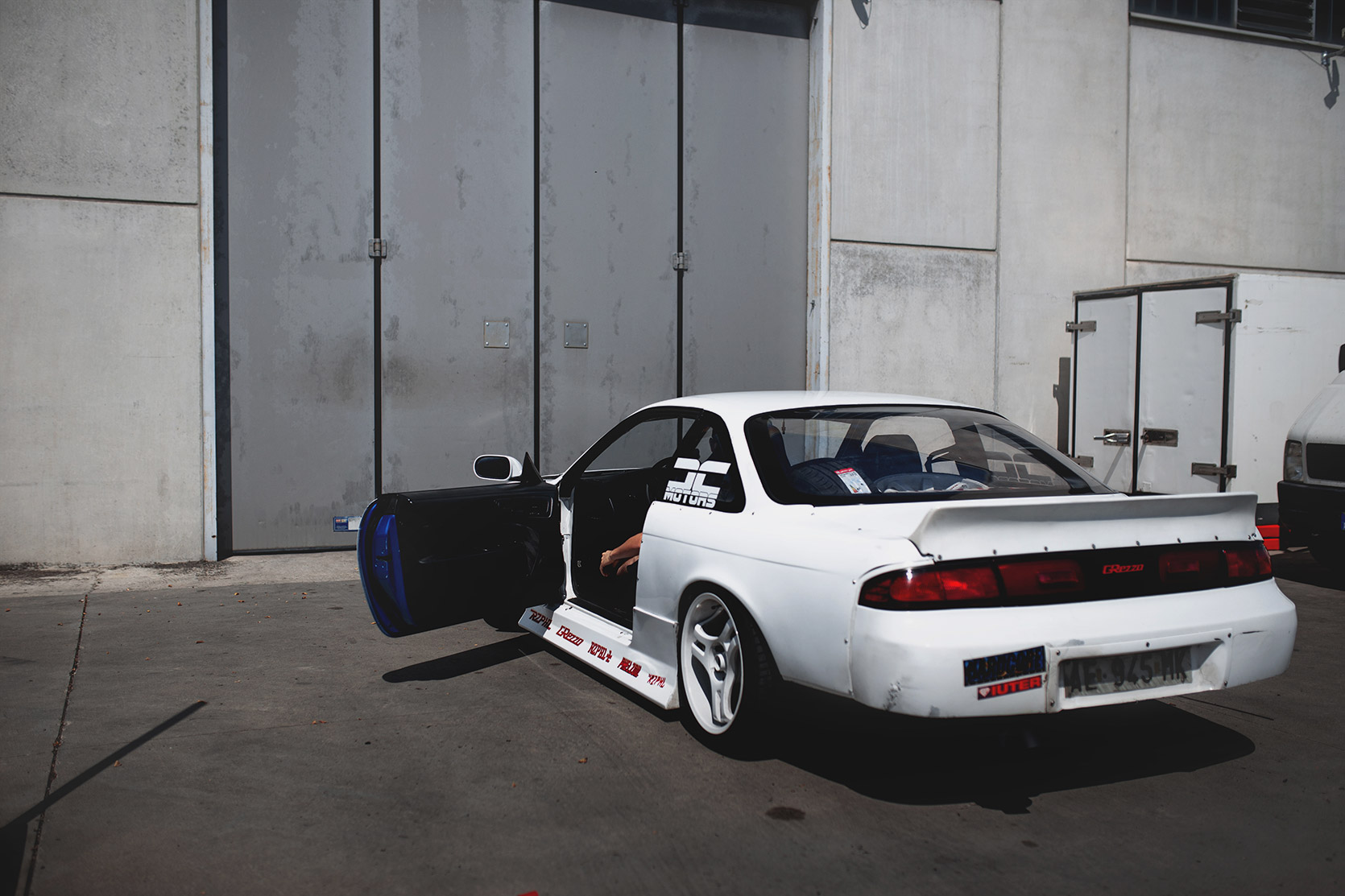 Rizphel's Nissan Silvia S14 waiting outside with a door open Castelletto Circuit di Branduzzo Garage