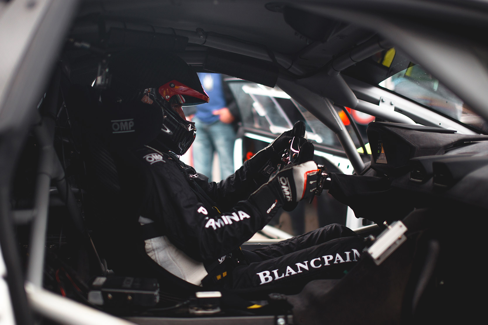 A Racing Driver on his Lamborghini Huracan Evo Super Trofeo in the paddock of Autodromo Nazionale Monza