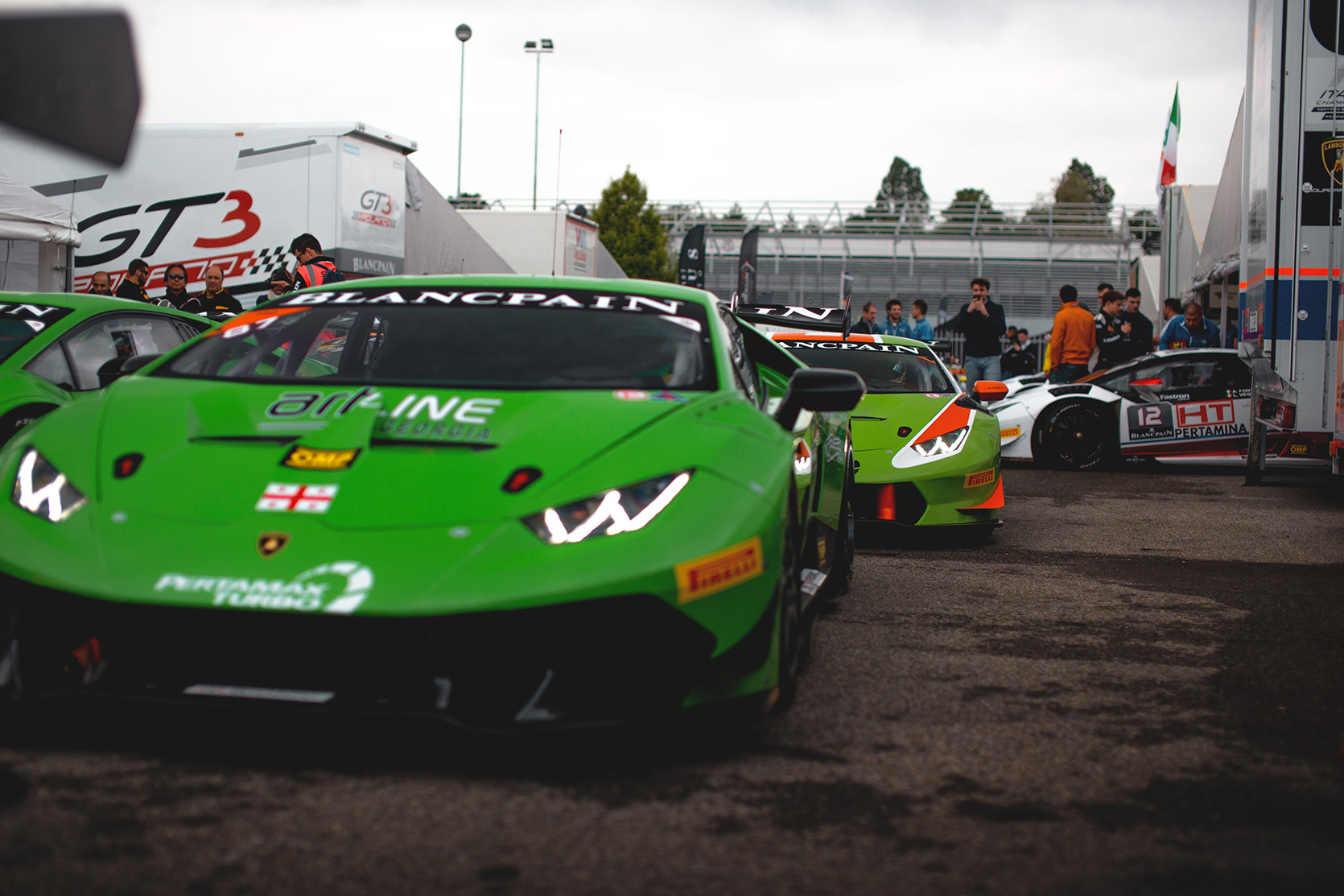 Two green Lamborghini Huracan Evo Super Trofeo in the paddock of Autodromo Nazionale Monza
