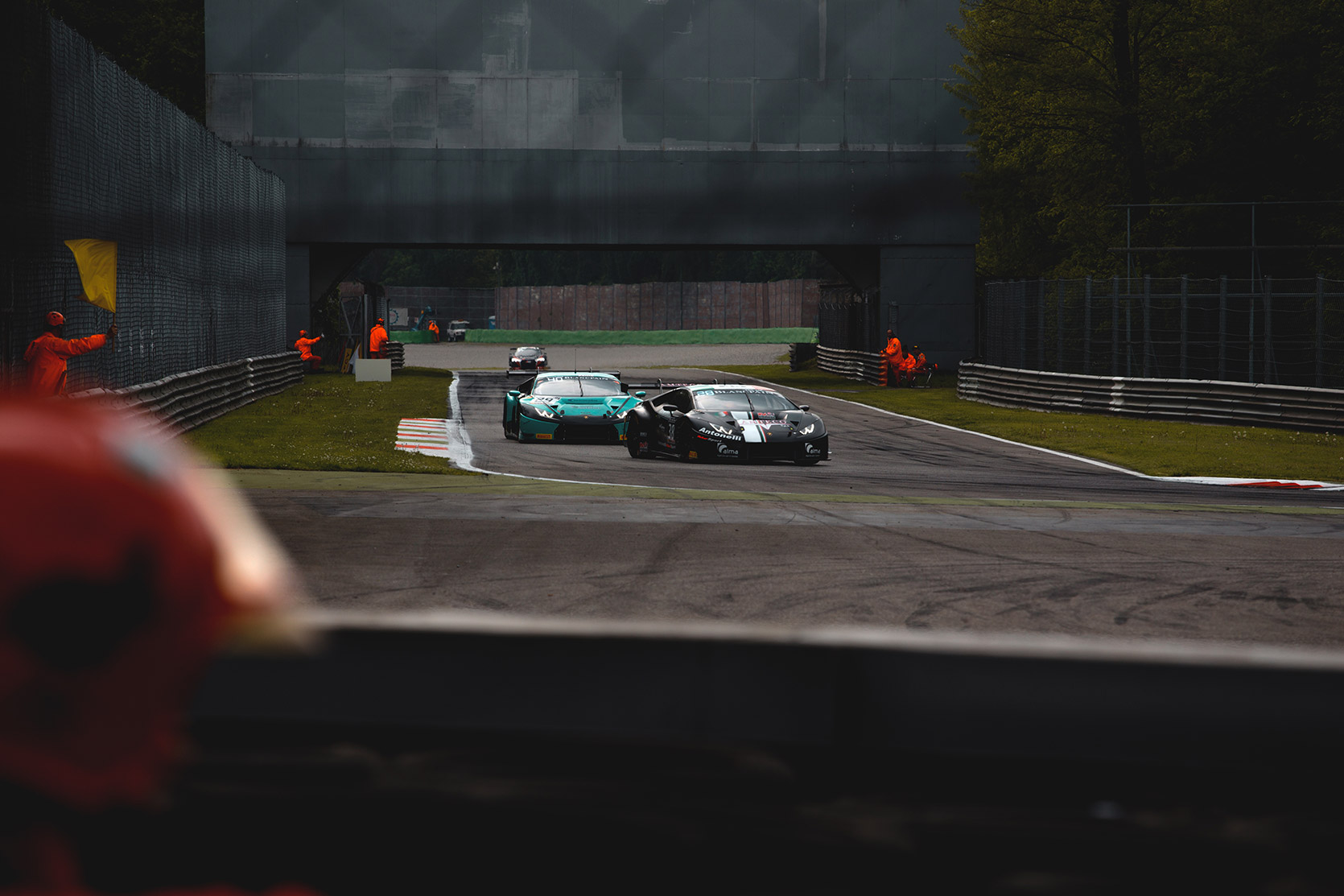 Yellow Flag at Seconda Variante curve while two Lamborghini Huracan Evo Super Trofeo passing at Autodromo Nazionale Monza
