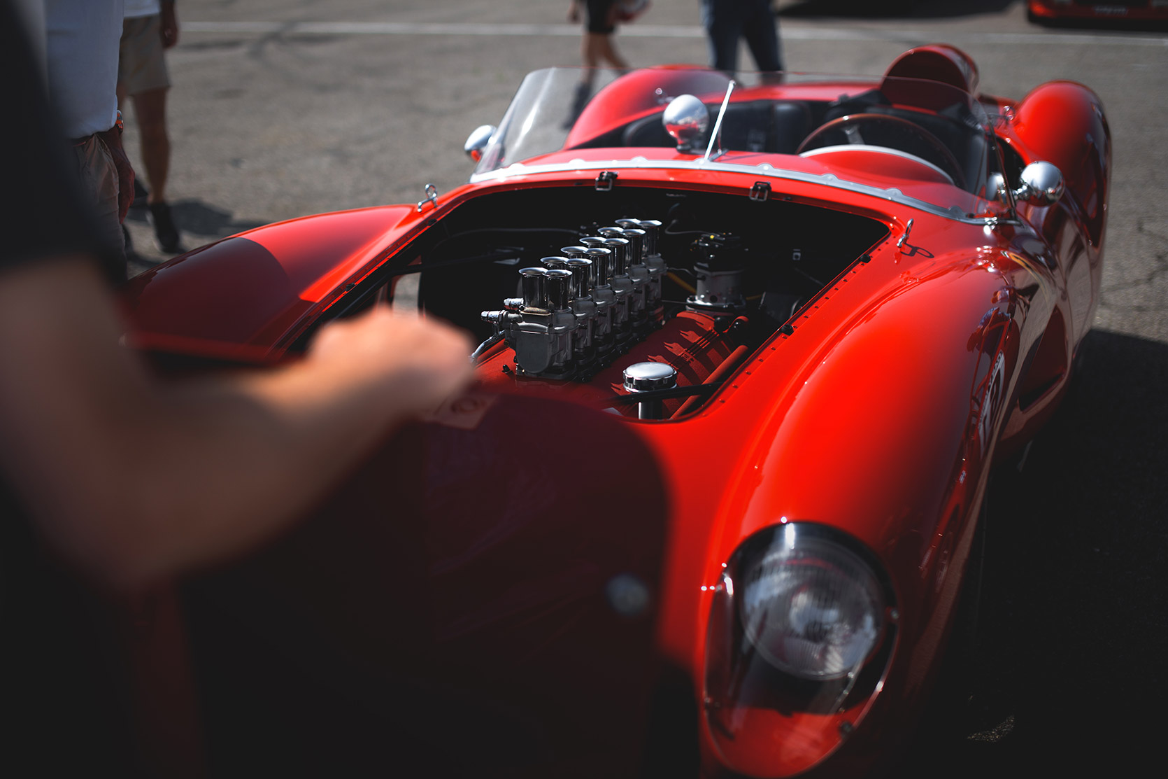 A front end of a Ferrari 250 Testa Rossa without its hood in the paddock of Autodromo Nazionale Monza at Modena 100 Ore