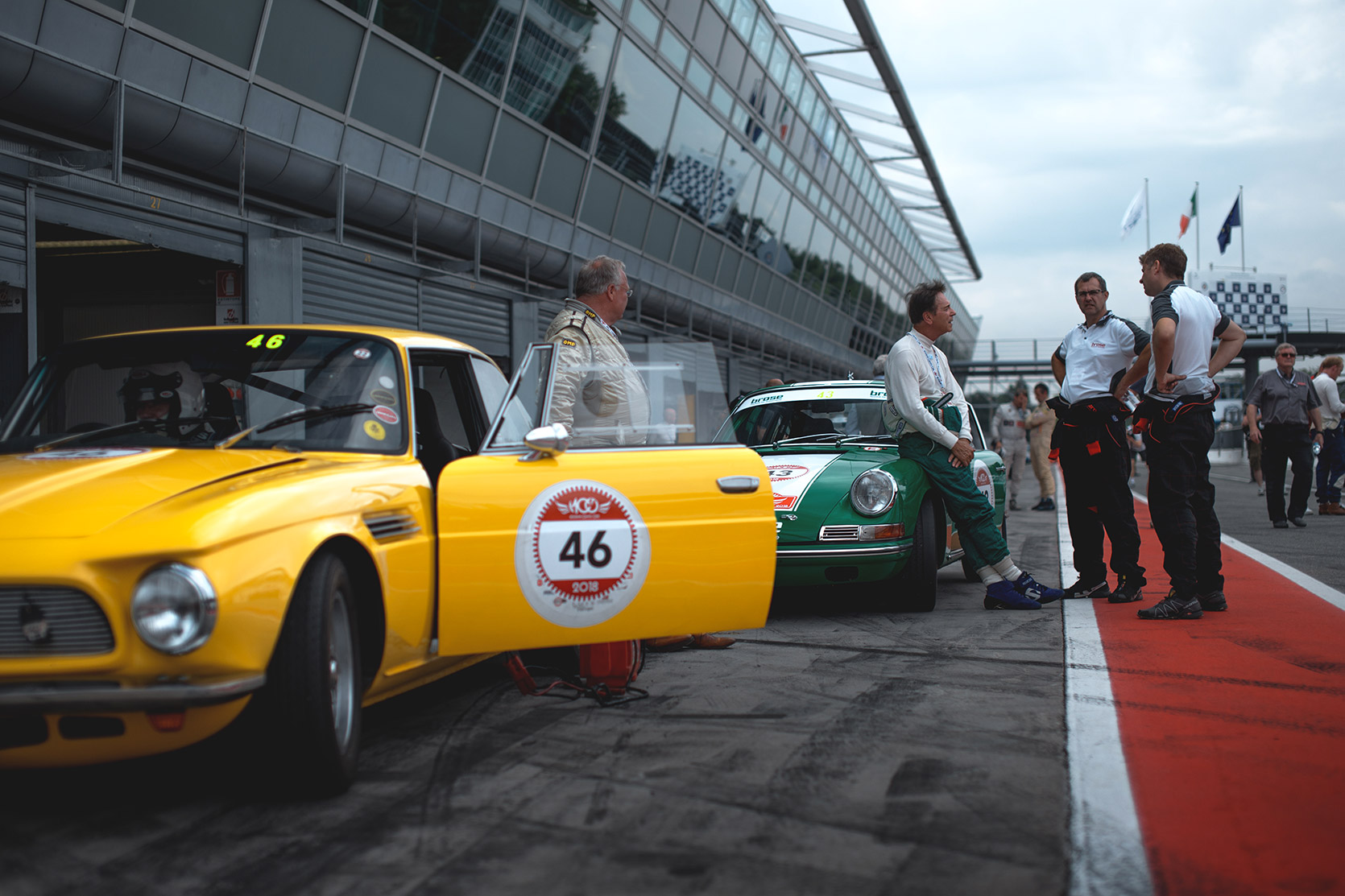 Waiting for Race in the Pitlane with an Iso Rivolta 340 Ir and a Porsche 911 Carrera at Modena 100 Ore