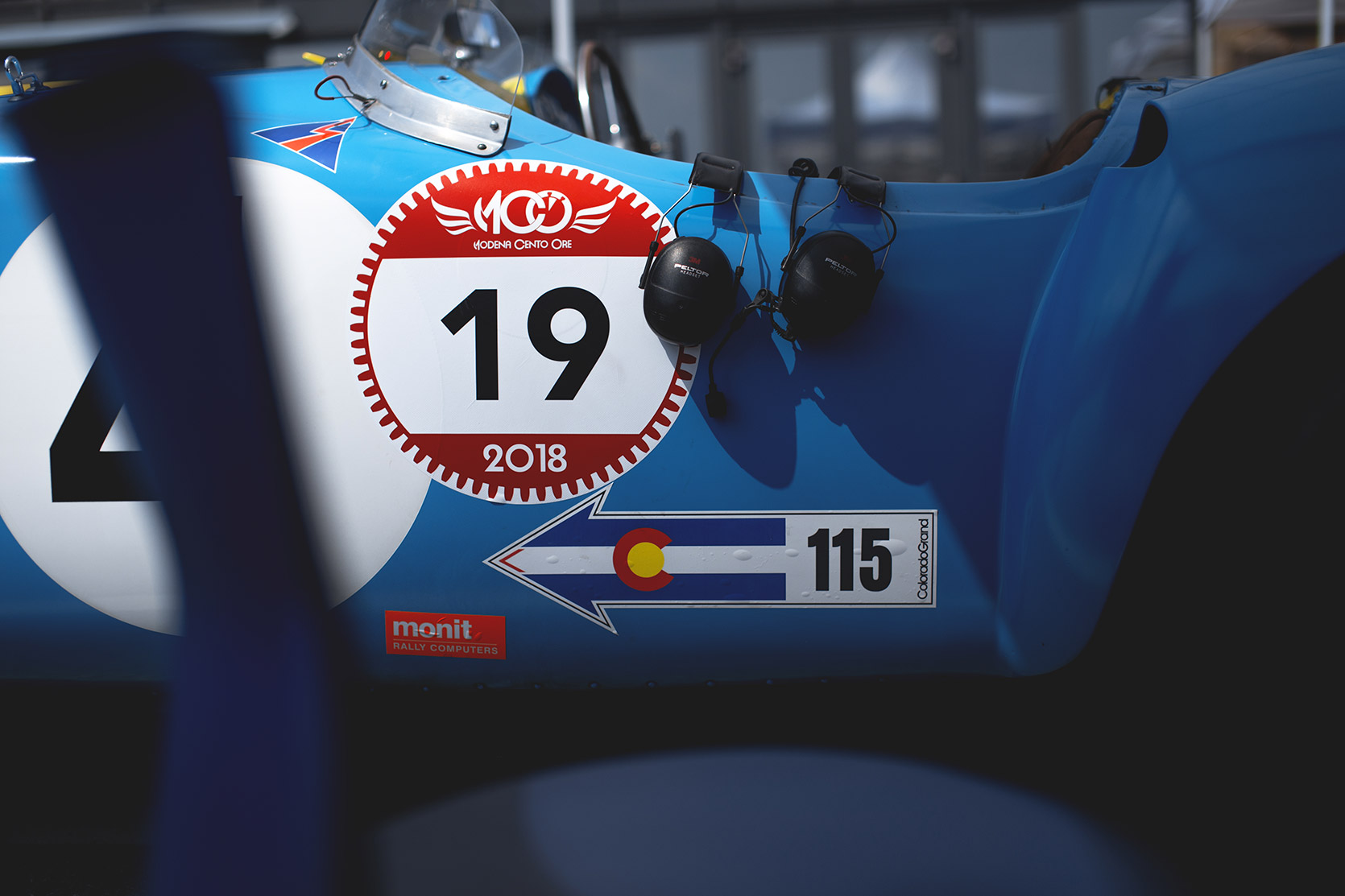 Modena 100 Ore sticker on a side of a Ferrari 375 MM Spider in the paddock of Autodromo Nazionale Monza