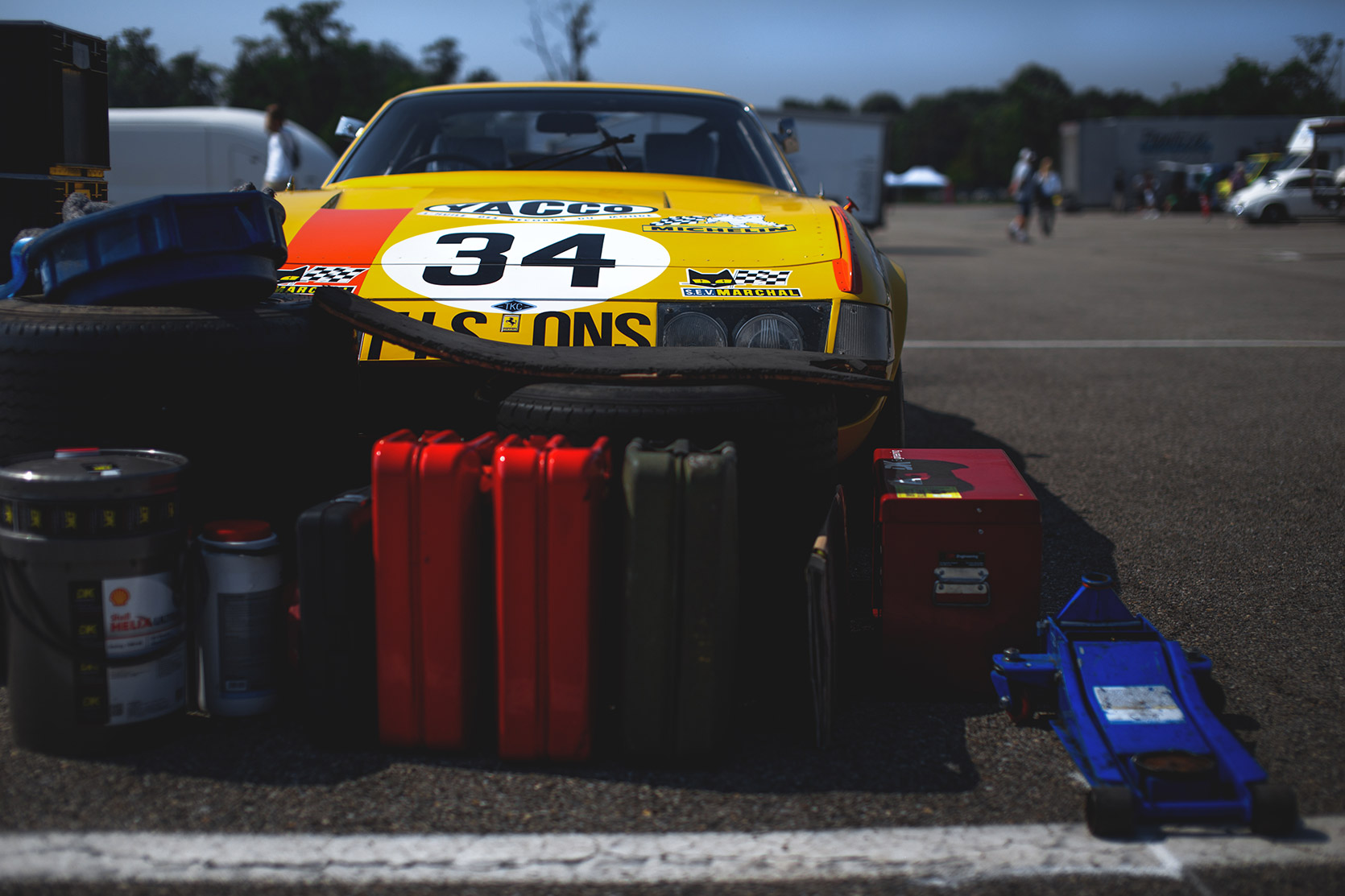 A Ferrari Daytona 365 GTB4 partially cover by maintenance stuff in the paddock of Autodromo Nazionale Monza at Modena 100 Ore