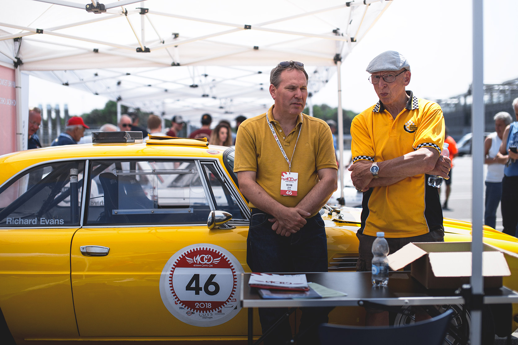 An Iso Rivolta 340 IR and its team at checks in the paddock of Autodromo Nazionale Monza at Modena 100 Ore