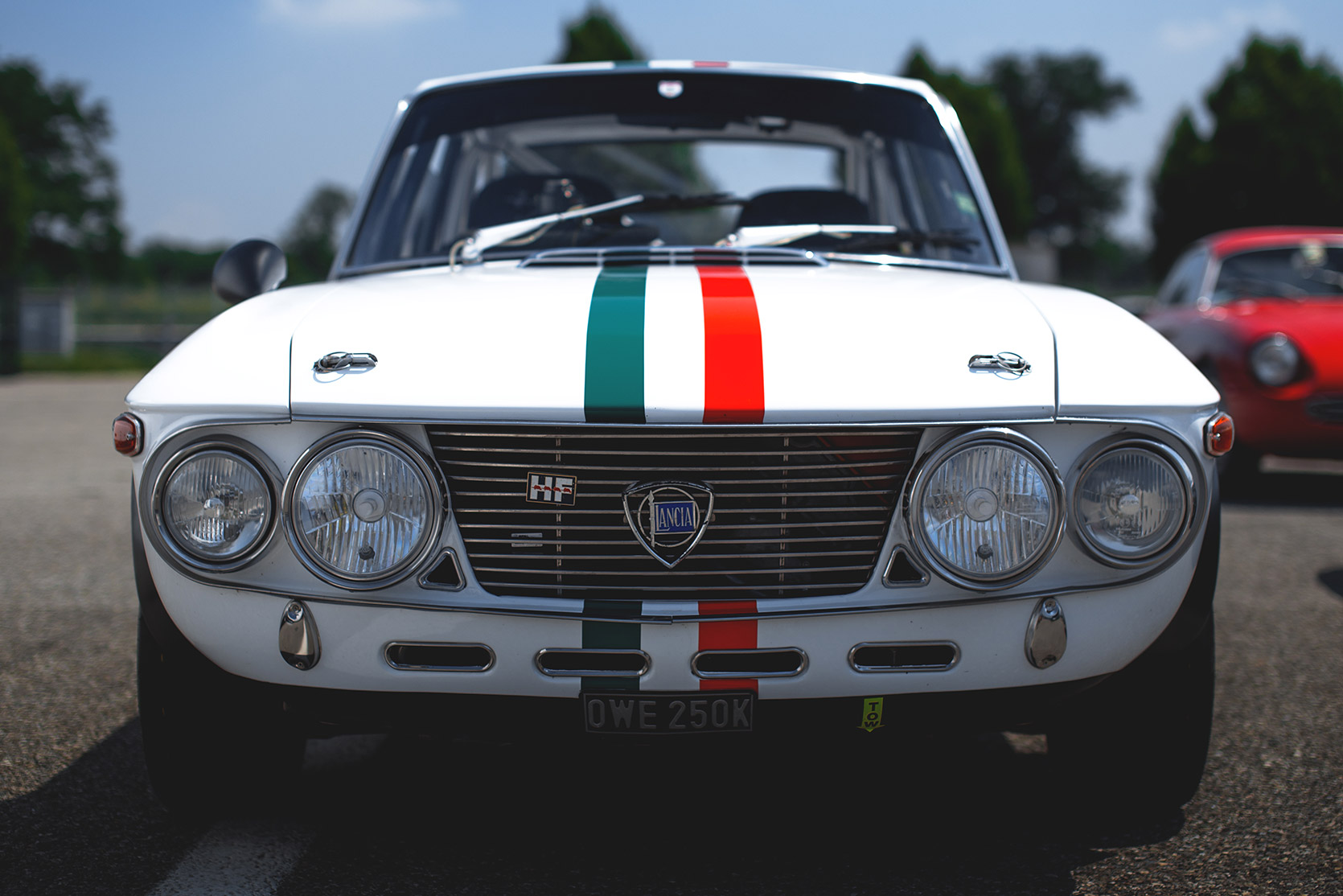 A Lancia Fulvia HF frontend in the paddock of Audromo Nazionale Monza at Modena 100 Ore