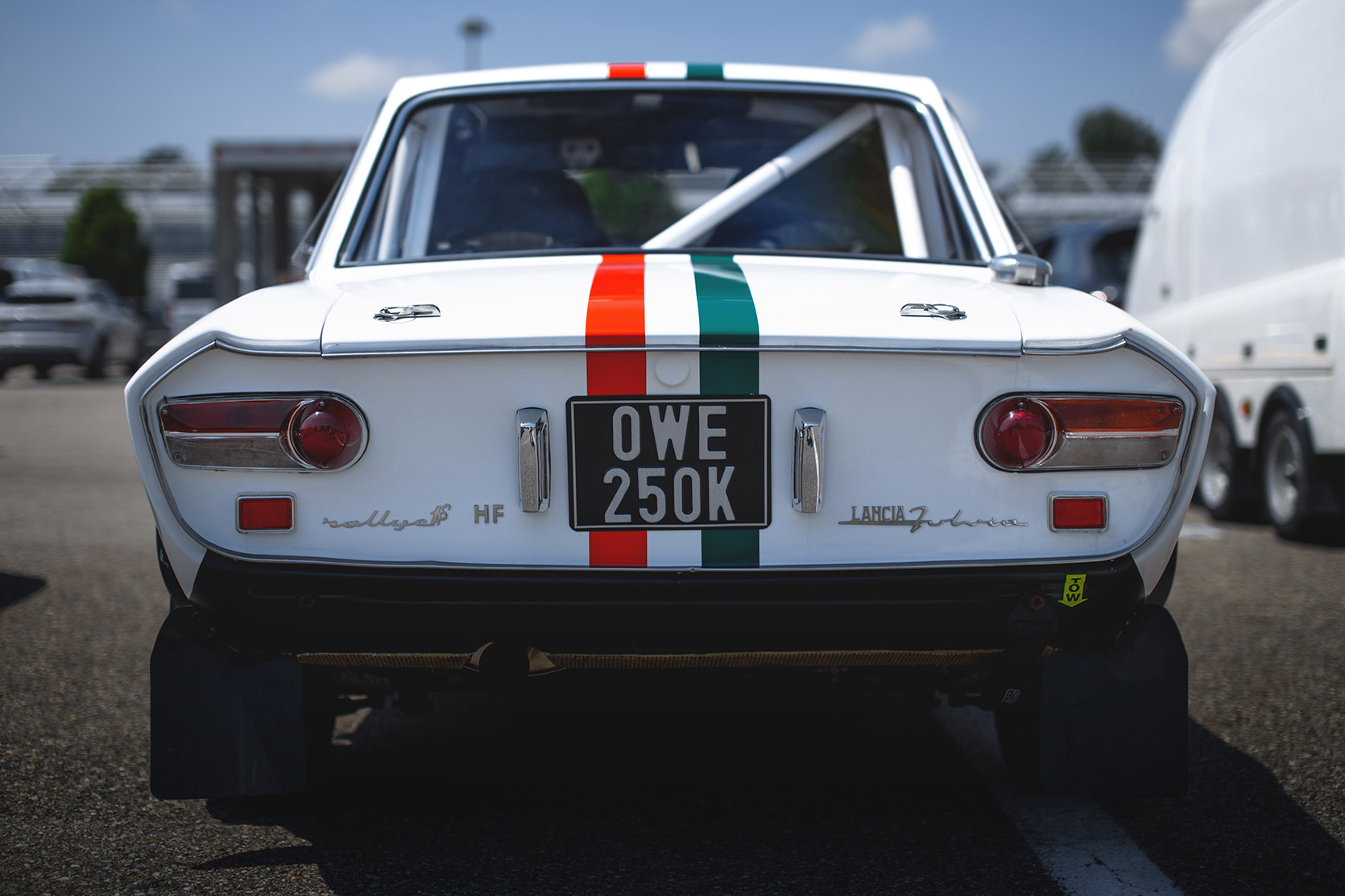 A Lancia Fulvia HF rearend in the paddock of Audromo Nazionale Monza at Modena 100 Ore
