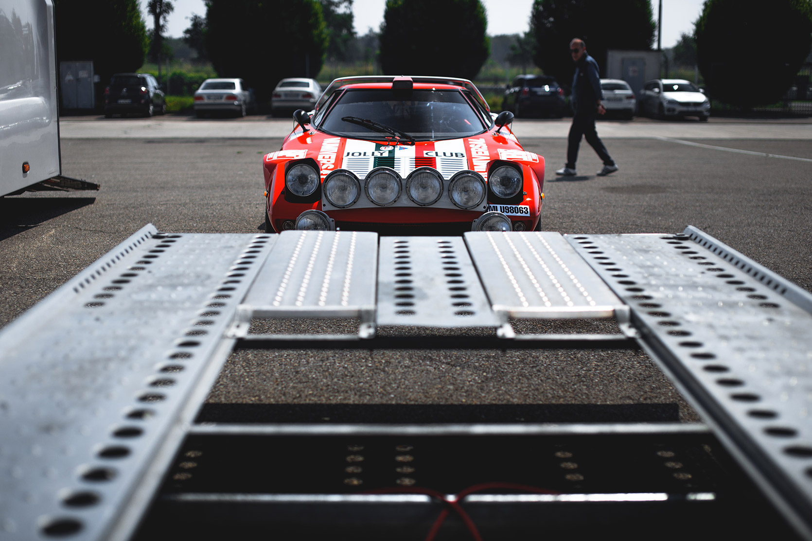 Front end of a Lancia Stratos and its trailer in the paddock of Autodromo Nazionale Monza at Modena 100 Ore