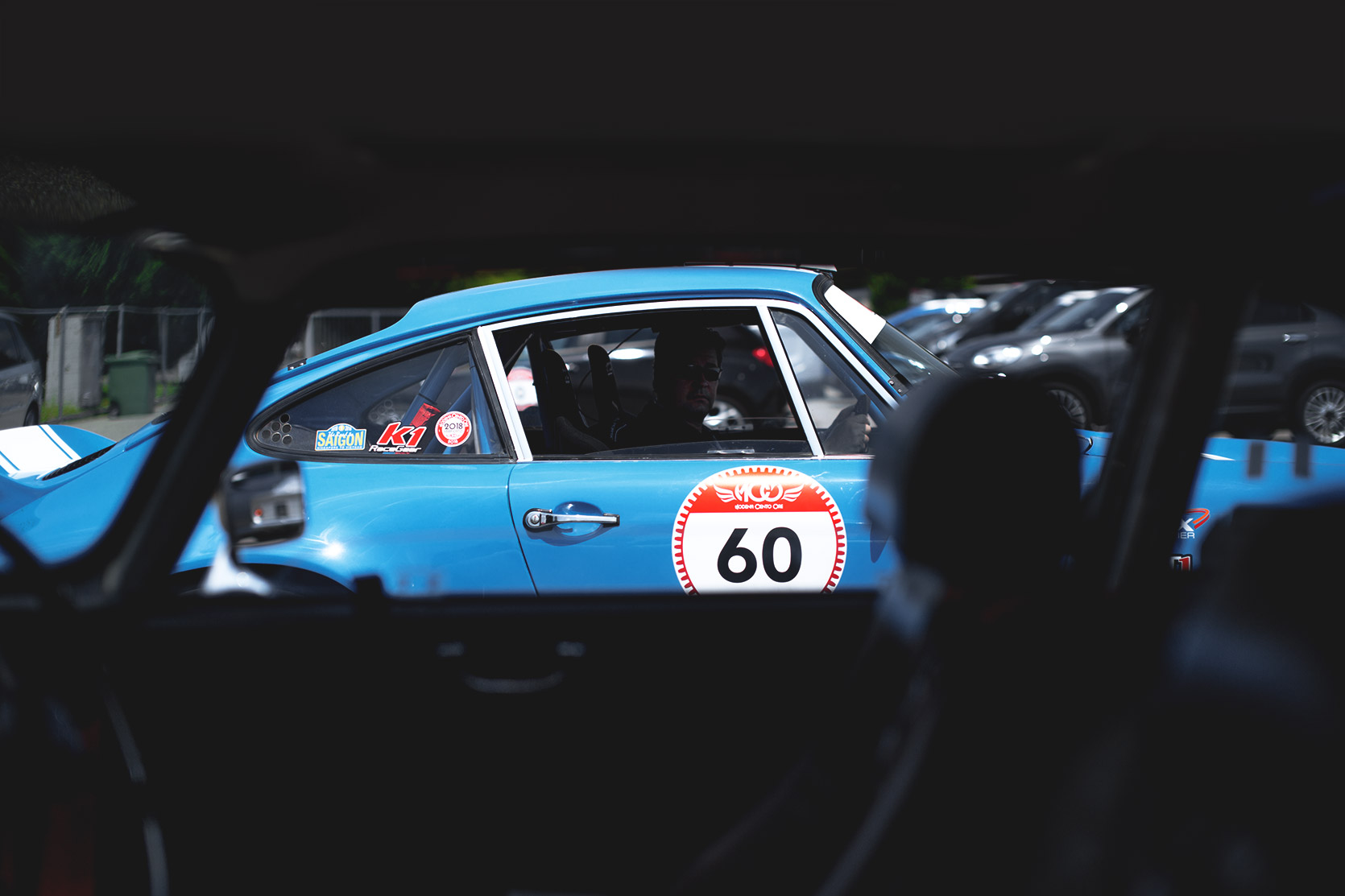 A Porsche 911 Carrera Rs in the paddock of Autodromo Nazionale Monza at Modena 100 Ore