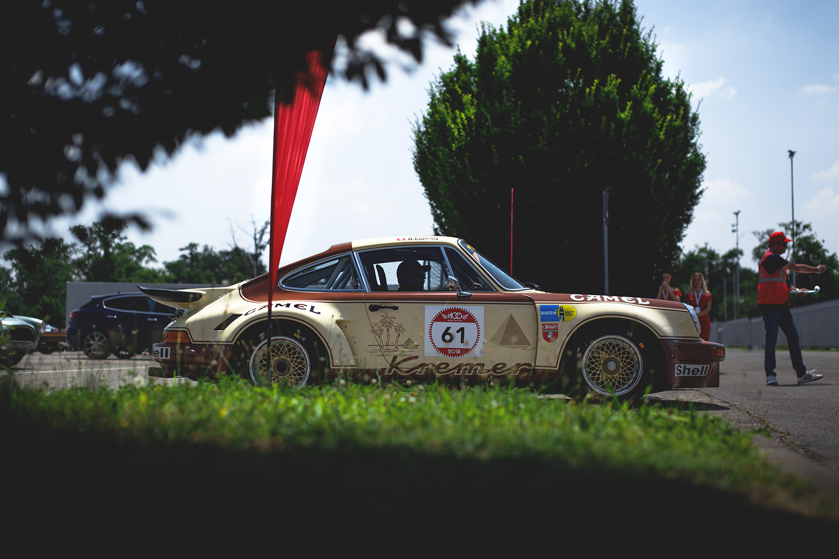 A Porsche 911 Carrera RS is going to chekcs in the paddock of Autodromo Nazionale Monza at Modena 100 Ore