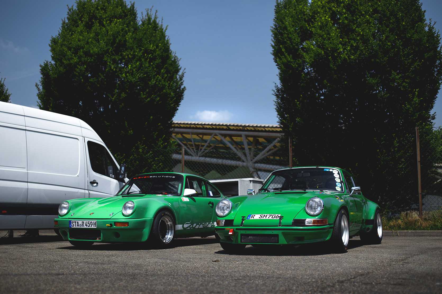 Two Porsche 911 Carrera RS and RSR in the paddock of Autodromo Nazionale Monza at Modena 100 Ore