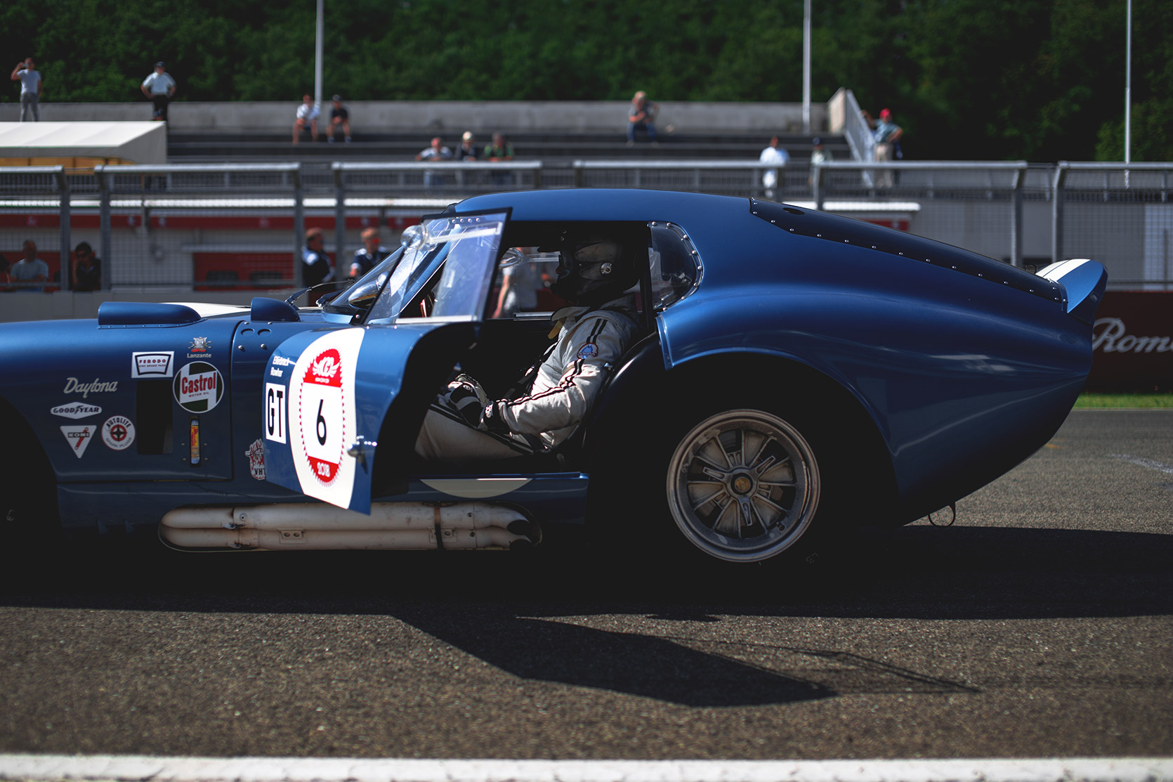 Driver waiting for the race in his Shelby Daytona Cobra Coupe in Autodromo Varano De Melegari at Modena 100 Ore