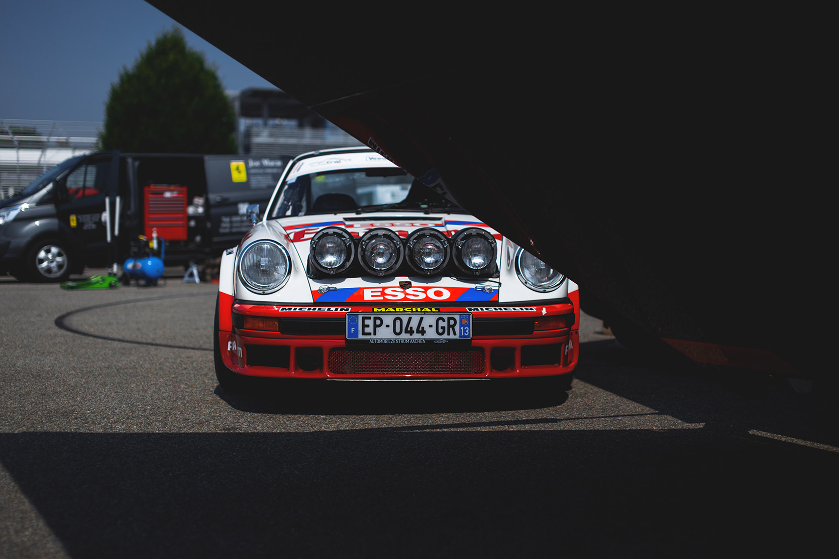A Porsche 911 Carrera RS unloaded in the paddock of Autodromo Nazionale Monza at Modena 100 Ore