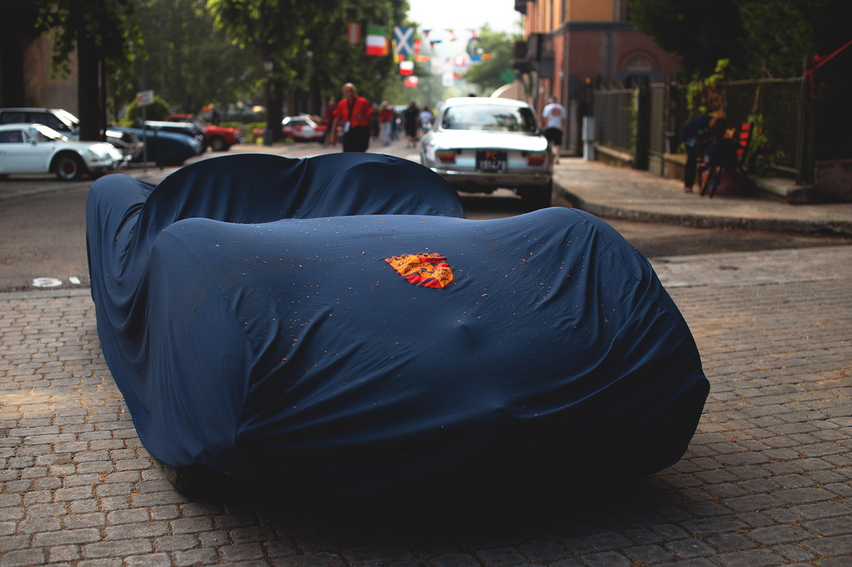 A covered Porsche parked at Vernasca Silver Flag